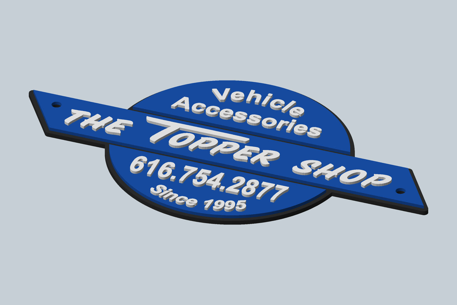 A three-color badge with The Topper Shop logo, shown as a 3D model