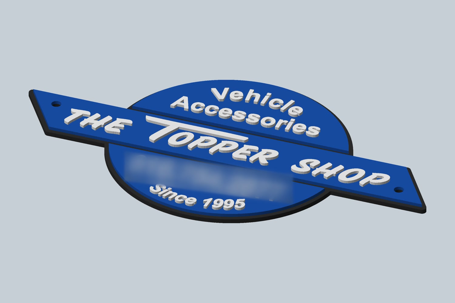 A three-color badge with The Topper Shop logo, shown as a 3D model